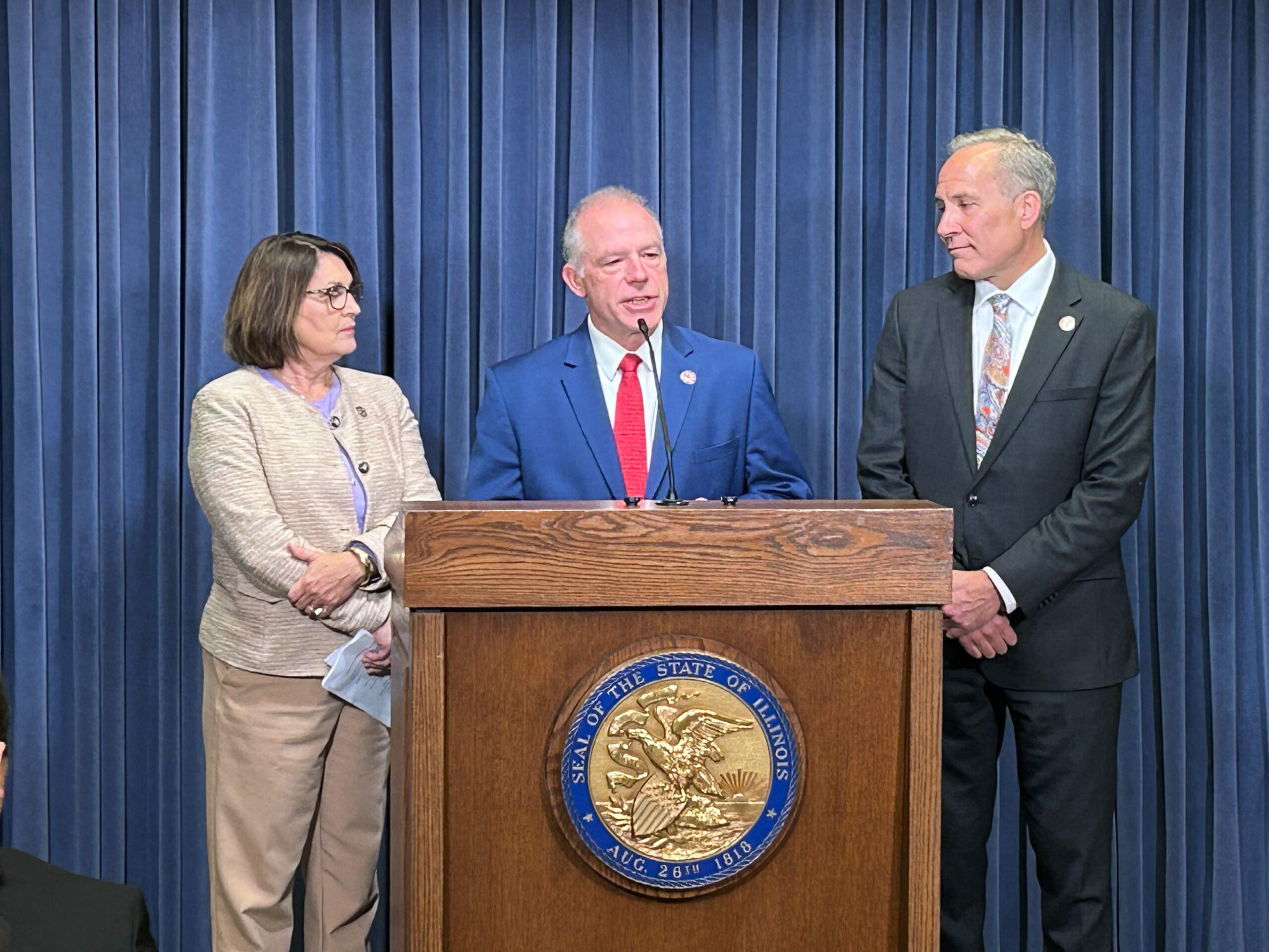 Senator Wilcox standing at a podium